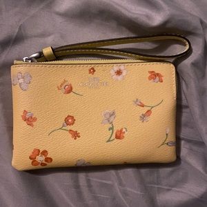 Yellow spring themed coach wristlet